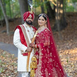Bride and groom posing together outdoors in traditional wedding attire, photographed by The Glorious Memories in New Hyde Park, NY.